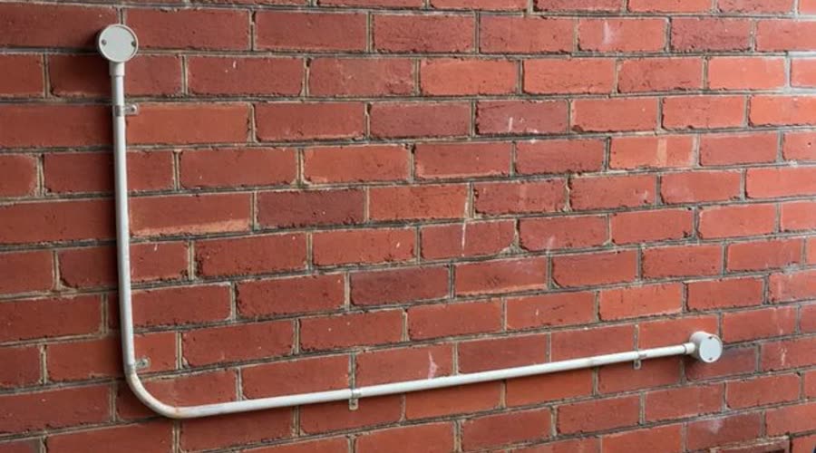 New conduit run on an Adelaide brick wall by Amped Up Electrical