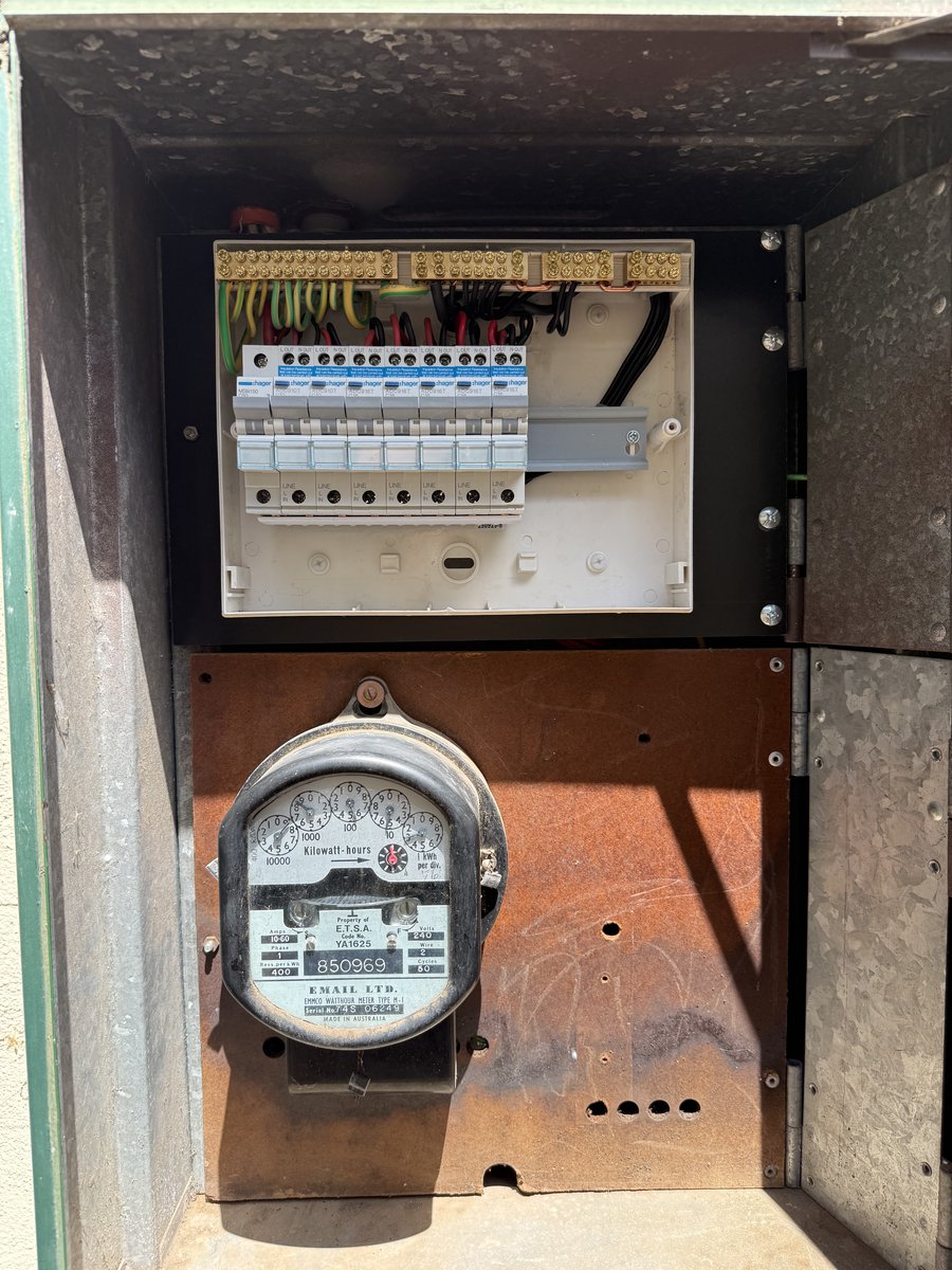 Heritage analog meter beneath a new Hager switchboard - Adelaide upgrade