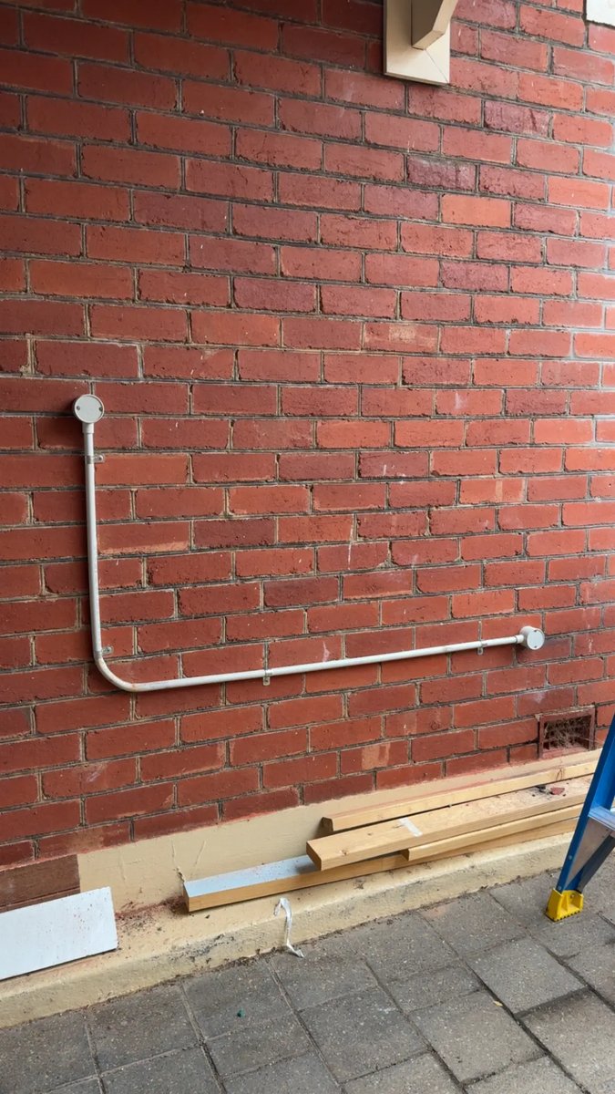 Neat conduit run on brick wall