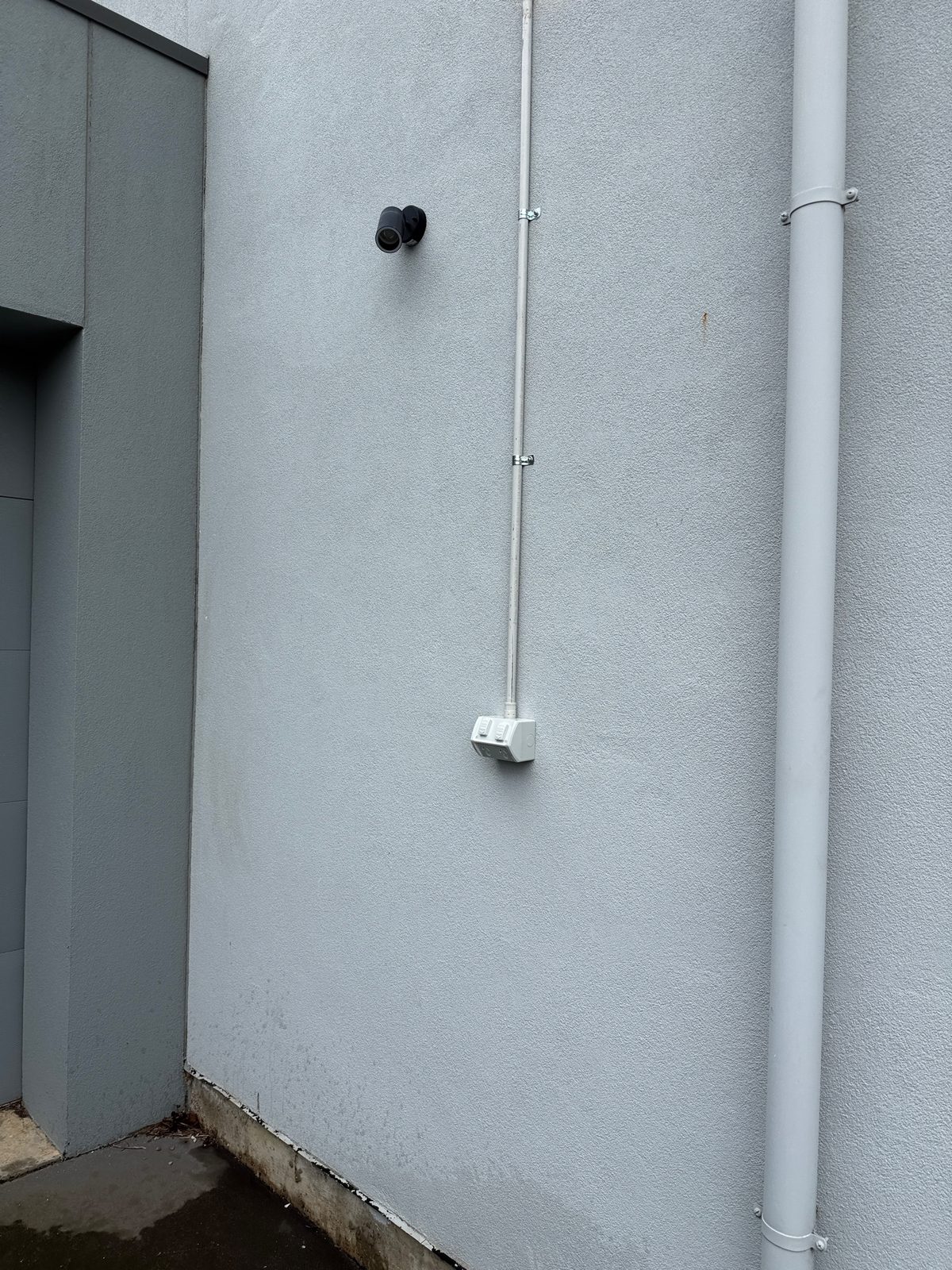 New weatherproof double outlet and conduit run on an exterior wall for EV charging in Magill