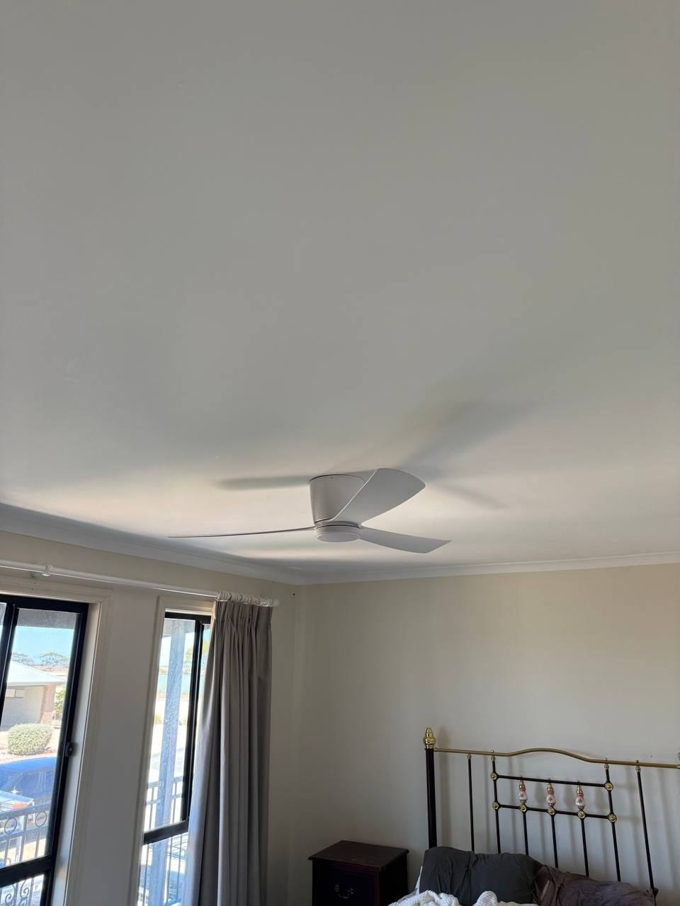 DC ceiling fan installed in a bedroom