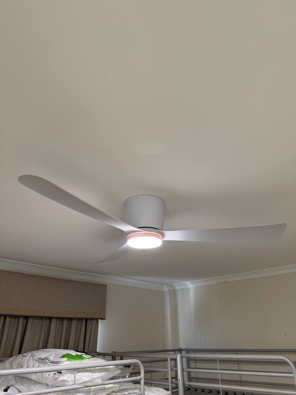 Ceiling fan with a light installed in a kids bedroom