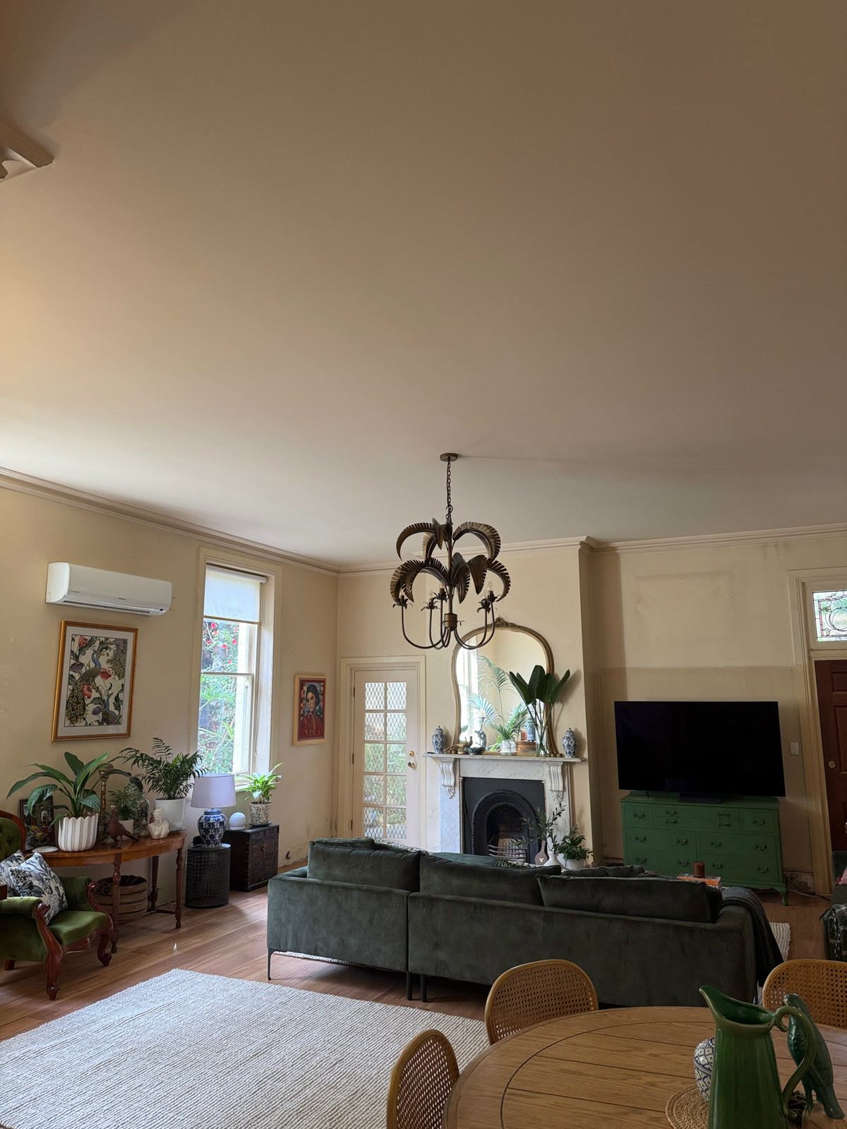 Brass palm-leaf chandelier hung in a heritage living room, North Adelaide