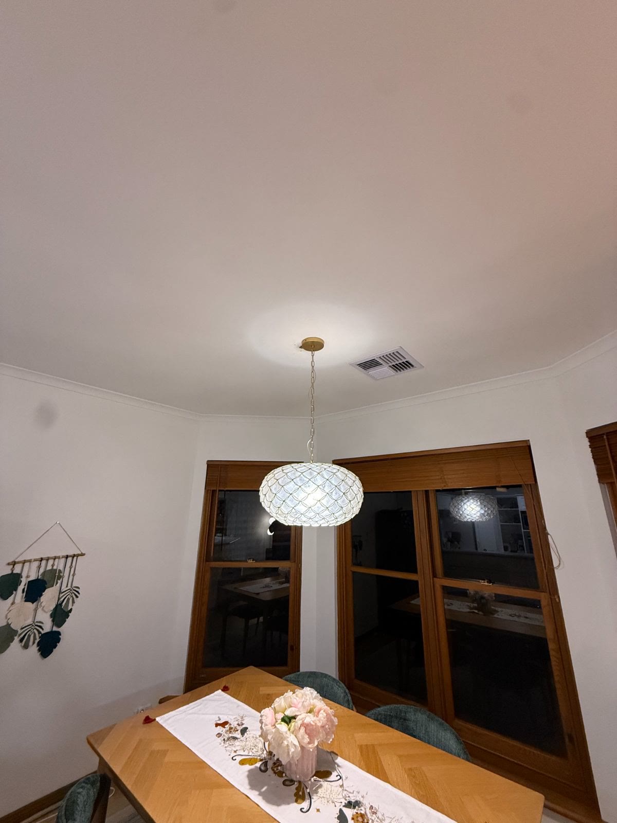 Pendant light hung over a dining table